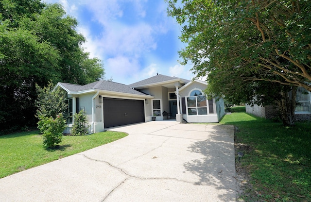 2905 Shalimar Ln, Shalimar, FL 32579 - view of front of home with stucco siding, driveway, a front yard, and a garage