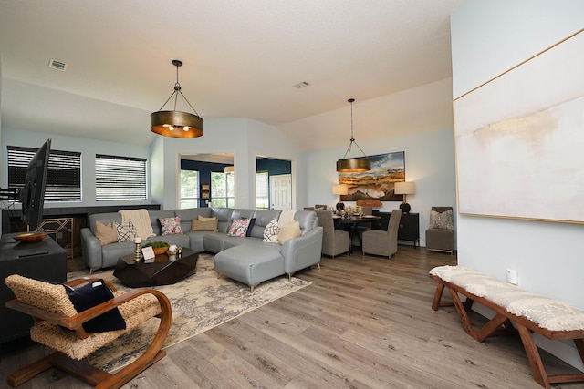 2905 Shalimar Ln, Shalimar, FL 32579 - living room featuring light wood-type flooring and vaulted ceiling