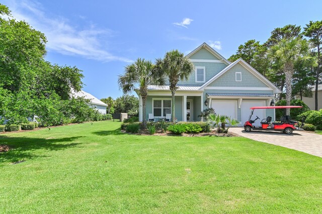 92 Maple St, Santa Rosa Beach, FL 32459 - view of front of property with an attached garage, a front yard, and driveway
