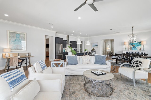 92 Maple St, Santa Rosa Beach, FL 32459 - living room featuring ornamental molding, wood finished floors, ceiling fan, recessed lighting, and a chandelier