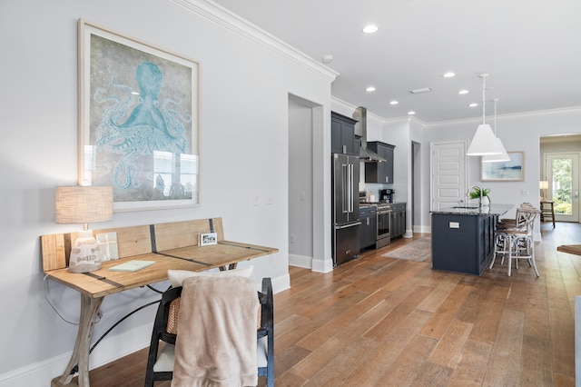 92 Maple St, Santa Rosa Beach, FL 32459 - kitchen featuring high quality appliances, ornamental molding, a kitchen bar, light wood-type flooring, and stone counters