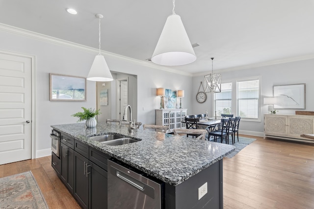 92 Maple St, Santa Rosa Beach, FL 32459 - kitchen with stainless steel appliances, light stone countertops, decorative light fixtures, and ornamental molding