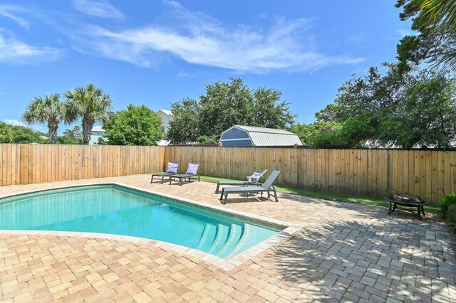 92 Maple St, Santa Rosa Beach, FL 32459 - view of swimming pool with a patio area, a fenced backyard, and a fire pit