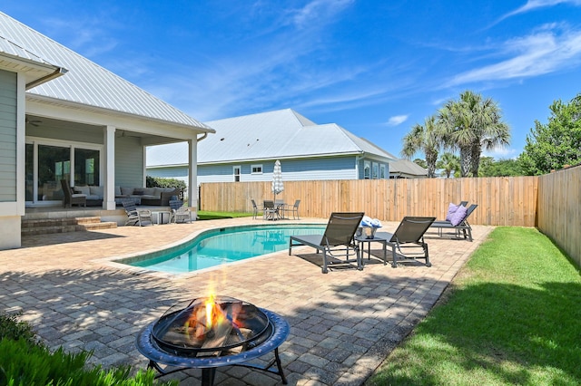 92 Maple St, Santa Rosa Beach, FL 32459 - view of swimming pool featuring a patio area, an outdoor living space with a fire pit, and a fenced backyard