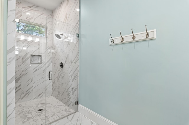 92 Maple St, Santa Rosa Beach, FL 32459 - bathroom with a marble finish shower and marble look tile flooring