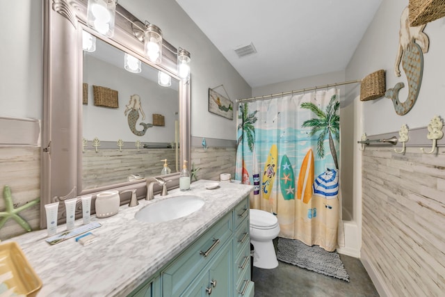17614 Front Beach Rd Unit D13, Panama City Beach, FL 32413 - full bathroom with finished concrete floors, toilet, vanity, shower / bath combo with shower curtain, and tile walls