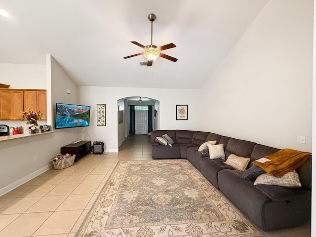 312 Scotch Pine Ln, Crestview, FL 32536 - living area with light tile patterned flooring, a ceiling fan, arched walkways, high vaulted ceiling, and baseboards