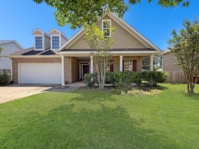 312 Scotch Pine Ln, Crestview, FL 32536 - view of front of home featuring an attached garage, driveway, brick siding, and a porch