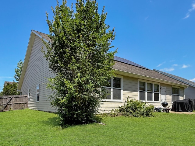 312 Scotch Pine Ln, Crestview, FL 32536 - back of property with roof mounted solar panels and a shingled roof