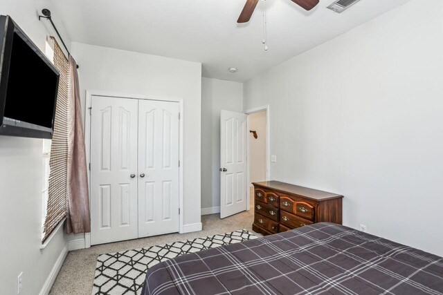 312 Scotch Pine Ln, Crestview, FL 32536 - bedroom featuring a closet, baseboards, carpet flooring, and a ceiling fan