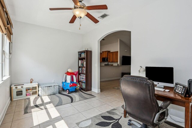 312 Scotch Pine Ln, Crestview, FL 32536 - office featuring light tile patterned flooring, ceiling fan, arched walkways, and baseboards