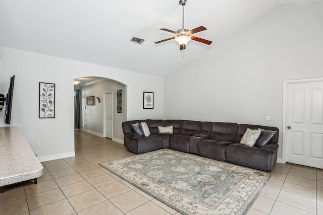 312 Scotch Pine Ln, Crestview, FL 32536 - living area featuring arched walkways, light tile patterned floors, a ceiling fan, high vaulted ceiling, and baseboards