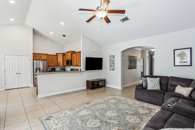 312 Scotch Pine Ln, Crestview, FL 32536 - living area featuring arched walkways, light tile patterned flooring, a ceiling fan, high vaulted ceiling, and recessed lighting