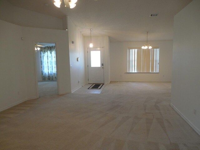 2095 Jessica Way, Navarre, FL 32566 - empty room featuring a chandelier, light carpet, and baseboards