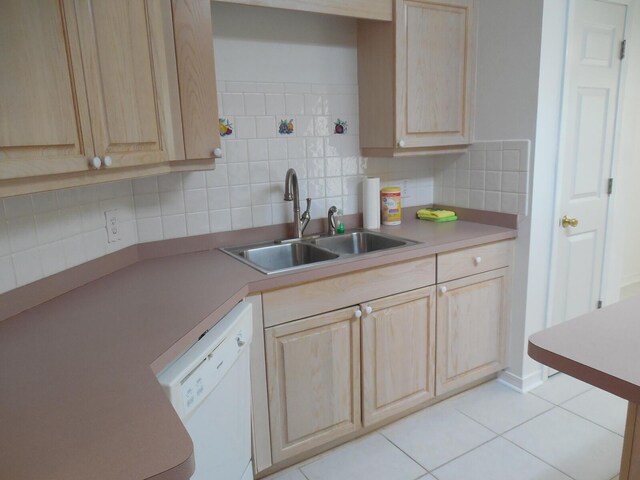 2095 Jessica Way, Navarre, FL 32566 - kitchen with light brown cabinetry, a sink, white dishwasher, light countertops, and decorative backsplash