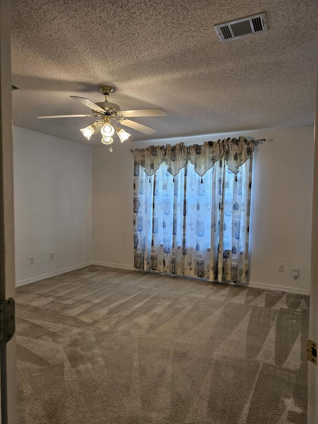 2095 Jessica Way, Navarre, FL 32566 - unfurnished room featuring carpet floors, a ceiling fan, baseboards, and a textured ceiling