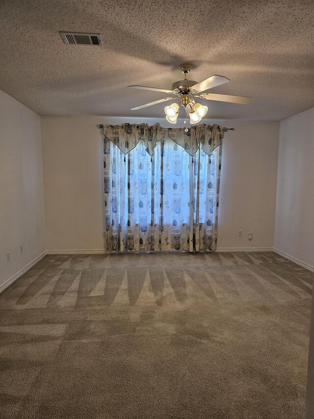 2095 Jessica Way, Navarre, FL 32566 - carpeted empty room featuring a ceiling fan, baseboards, and a textured ceiling