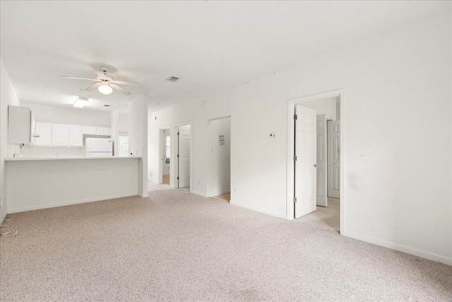 34 Herons Watch Way Unit 1203, Santa Rosa Beach, FL 32459 - unfurnished living room featuring light carpet, ceiling fan, and baseboards