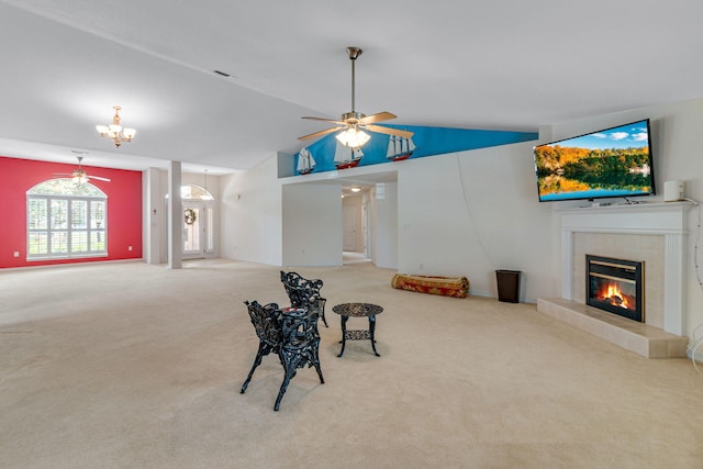 207 E Shipwreck Rd, Santa Rosa Beach, FL 32459 - living area with vaulted ceiling, carpet flooring, a fireplace, and ceiling fan
