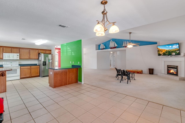 207 E Shipwreck Rd, Santa Rosa Beach, FL 32459 - kitchen featuring white appliances, open floor plan, light carpet, ceiling fan, and vaulted ceiling