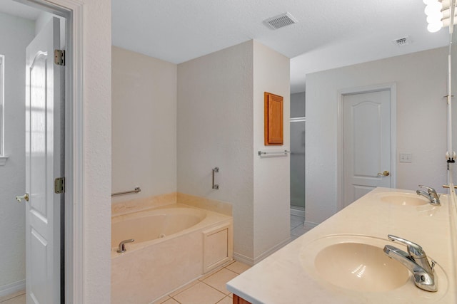 207 E Shipwreck Rd, Santa Rosa Beach, FL 32459 - full bath with double vanity, a garden tub, and tile patterned floors