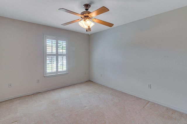 207 E Shipwreck Rd, Santa Rosa Beach, FL 32459 - unfurnished room featuring light carpet, baseboards, and a ceiling fan