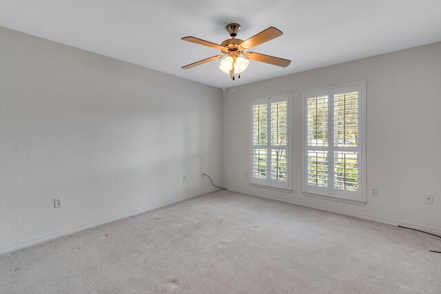 207 E Shipwreck Rd, Santa Rosa Beach, FL 32459 - carpeted spare room featuring a ceiling fan and baseboards