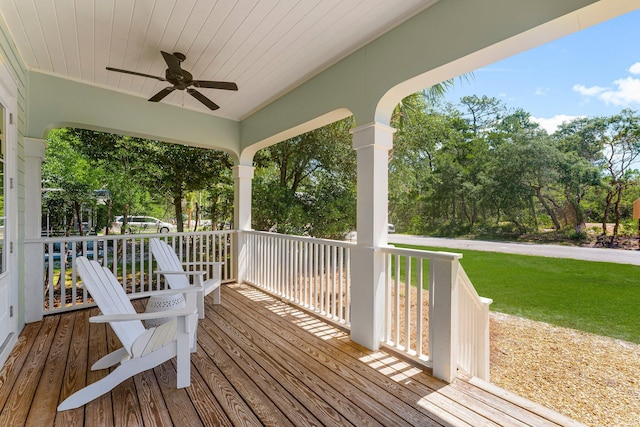 515 Seacrest Dr, Inlet Beach, FL 32461 - wooden porch featuring ceiling fan, a yard, and view of wooded area
