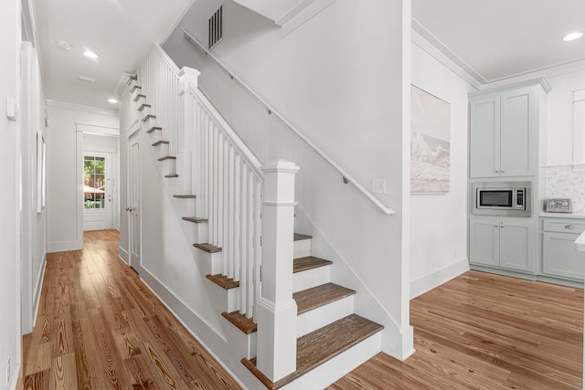 515 Seacrest Dr, Inlet Beach, FL 32461 - stairway with ornamental molding, wood finished floors, baseboards, and recessed lighting
