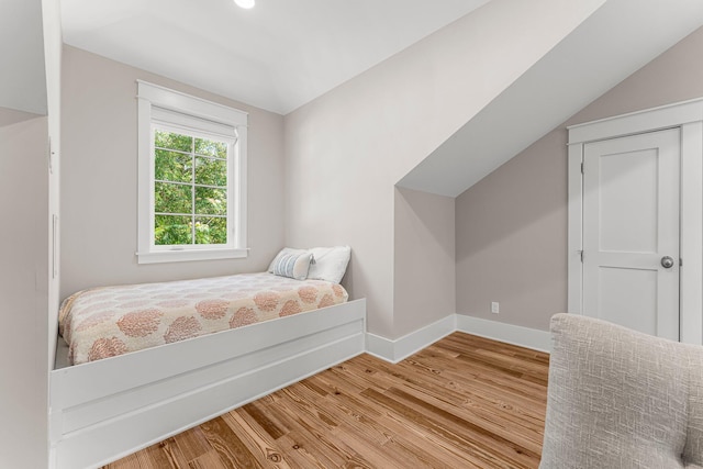 515 Seacrest Dr, Inlet Beach, FL 32461 - bedroom with wood finished floors, baseboards, and lofted ceiling