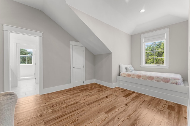 515 Seacrest Dr, Inlet Beach, FL 32461 - unfurnished bedroom featuring lofted ceiling, light wood-type flooring, recessed lighting, and baseboards