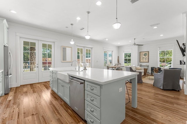 515 Seacrest Dr, Inlet Beach, FL 32461 - kitchen featuring french doors, appliances with stainless steel finishes, a sink, gray cabinets, and light wood-style flooring