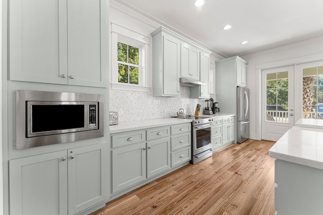 515 Seacrest Dr, Inlet Beach, FL 32461 - kitchen featuring stainless steel appliances, under cabinet range hood, light wood-type flooring, healthy amount of natural light, and recessed lighting
