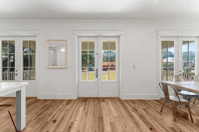 515 Seacrest Dr, Inlet Beach, FL 32461 - entryway with french doors, baseboards, light wood finished floors, and ornamental molding