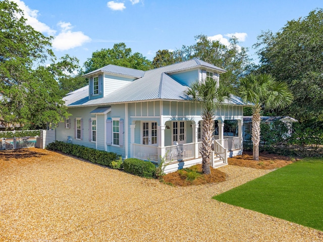 515 Seacrest Dr, Inlet Beach, FL 32461 - view of front facade featuring a porch and metal roof