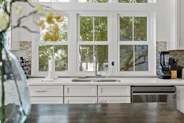 106 N Winston Ln, Inlet Beach, FL 32461 - kitchen with dishwasher, white cabinets, decorative backsplash, light countertops, and plenty of natural light
