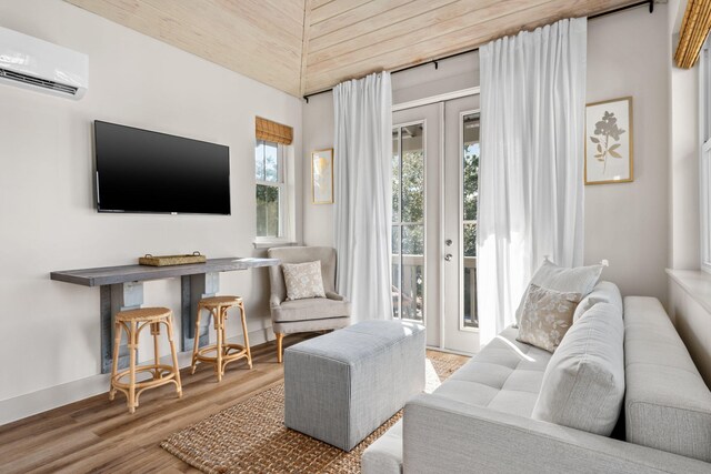 106 N Winston Ln, Inlet Beach, FL 32461 - living room featuring a wall mounted AC, wooden ceiling, wood finished floors, lofted ceiling, and french doors