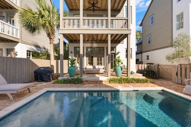 106 N Winston Ln, Inlet Beach, FL 32461 - rear view of house featuring a ceiling fan, a balcony, outdoor lounge area, a patio area, and a fenced backyard