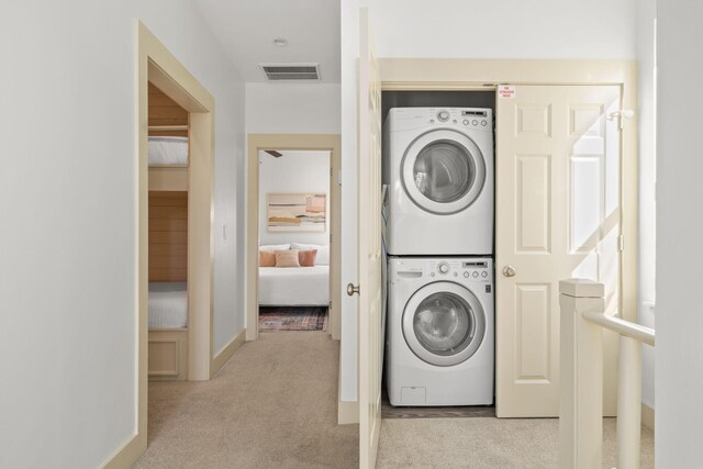 106 N Winston Ln, Inlet Beach, FL 32461 - washroom featuring stacked washing machine and dryer and light colored carpet