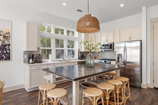 106 N Winston Ln, Inlet Beach, FL 32461 - kitchen with stainless steel appliances, tasteful backsplash, dark wood-type flooring, and recessed lighting