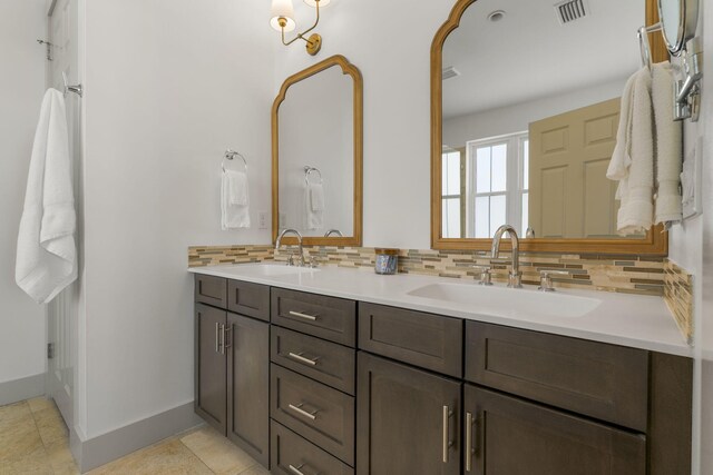 106 N Winston Ln, Inlet Beach, FL 32461 - bathroom with double vanity, tasteful backsplash, and tile patterned floors