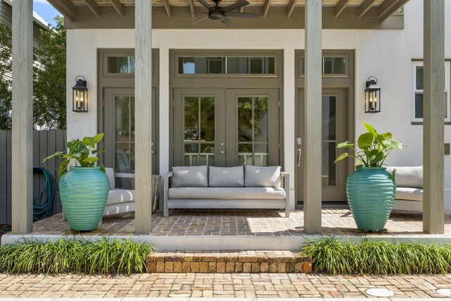 106 N Winston Ln, Inlet Beach, FL 32461 - view of exterior entry featuring french doors, stucco siding, and a ceiling fan