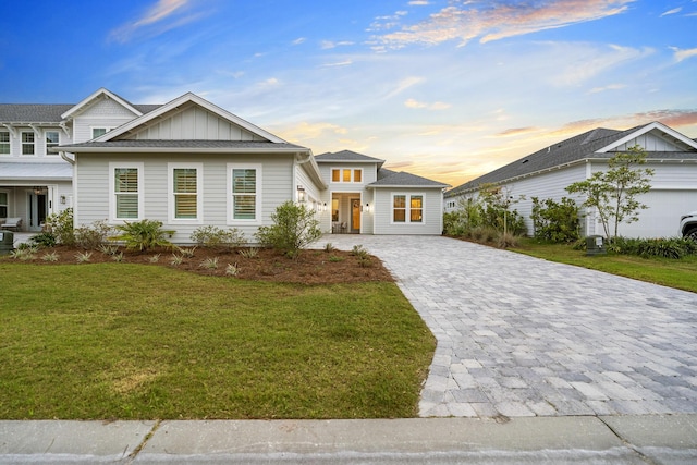 425 W Lafayette, Inlet Beach, FL 32461 - view of front of property with board and batten siding, decorative driveway, and a front yard