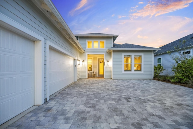 425 W Lafayette, Inlet Beach, FL 32461 - traditional-style home featuring decorative driveway, an attached garage, and roof with shingles