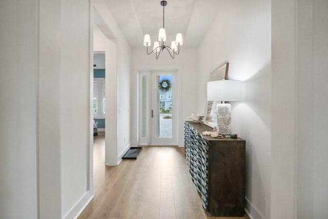 425 W Lafayette, Inlet Beach, FL 32461 - foyer with a chandelier, light wood-style flooring, and baseboards