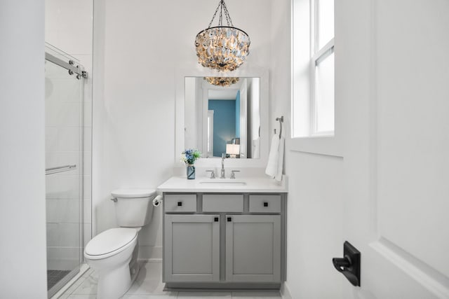 425 W Lafayette, Inlet Beach, FL 32461 - bathroom featuring toilet, vanity, a shower stall, a chandelier, and baseboards