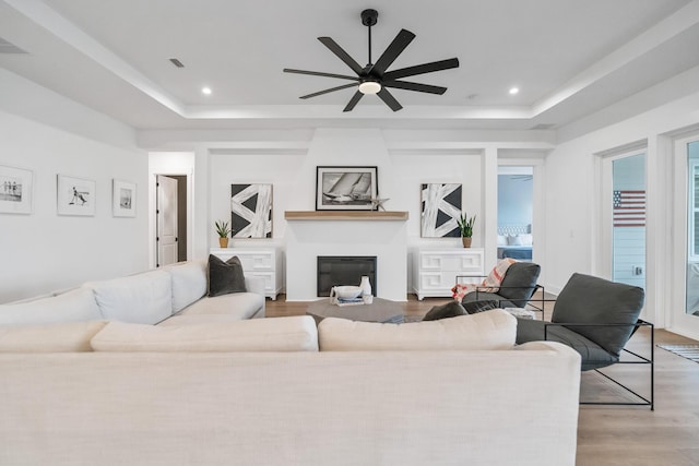 425 W Lafayette, Inlet Beach, FL 32461 - living area with a raised ceiling, ceiling fan, wood finished floors, recessed lighting, and a large fireplace