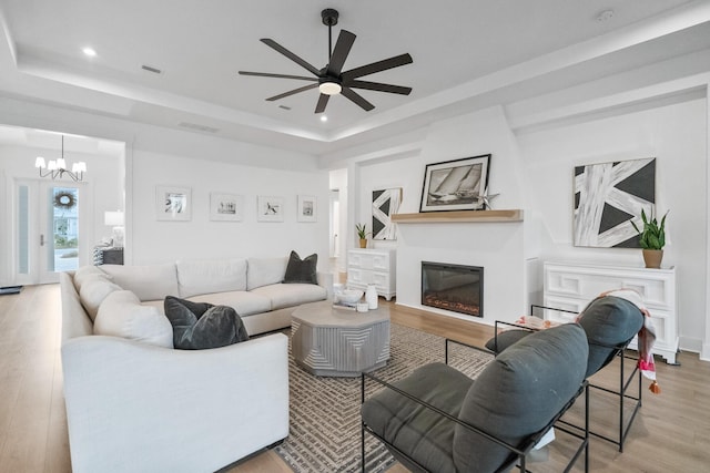425 W Lafayette, Inlet Beach, FL 32461 - living room featuring a raised ceiling, a glass covered fireplace, wood finished floors, recessed lighting, and a ceiling fan