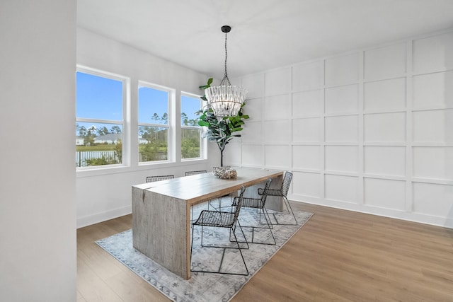 425 W Lafayette, Inlet Beach, FL 32461 - dining area featuring a chandelier and light wood-type flooring