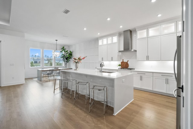 425 W Lafayette, Inlet Beach, FL 32461 - kitchen with wall chimney exhaust hood, a sink, plenty of natural light, light wood finished floors, and recessed lighting